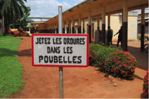 Focused or targeted services only help a few people for a small amount of time. To ensure sustainability, FC+ supports the entire facility by training providers and auxiliary staff to update and maintain infection prevention practices and medical standards. This sign in French is from the grounds of a supported site in DR Congo asking all visitors and staff of the hospital to use trash cans.  